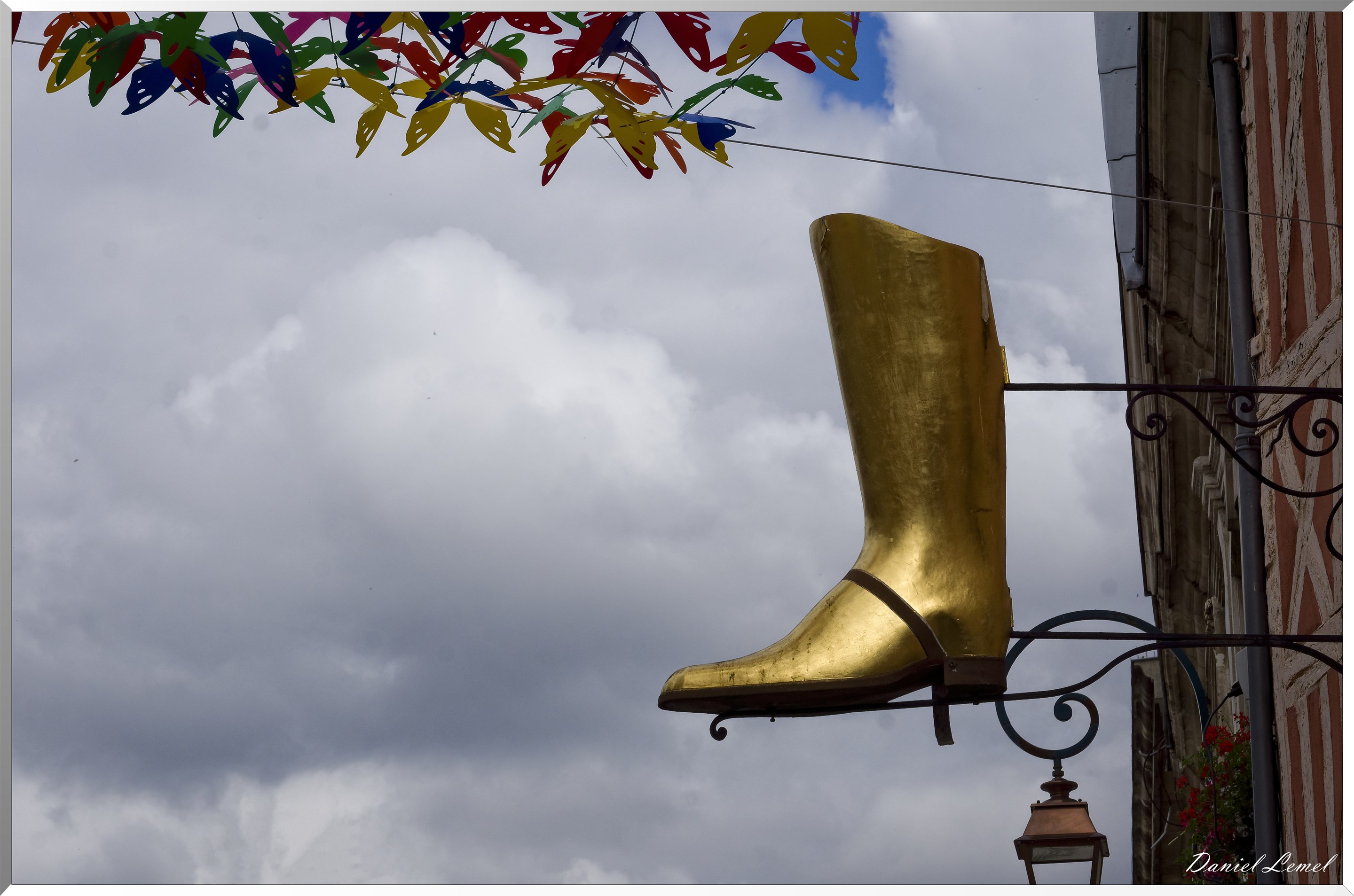 Enseigne botte dorée